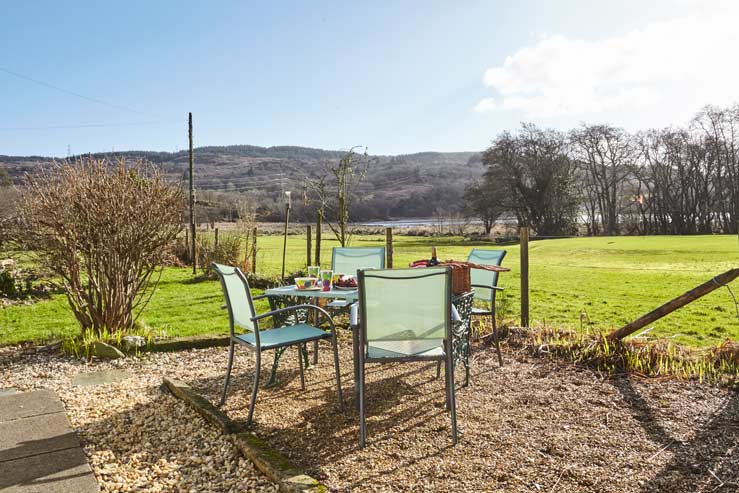 Outdoor seating area with view of loch Outdoor seating area with view of loch